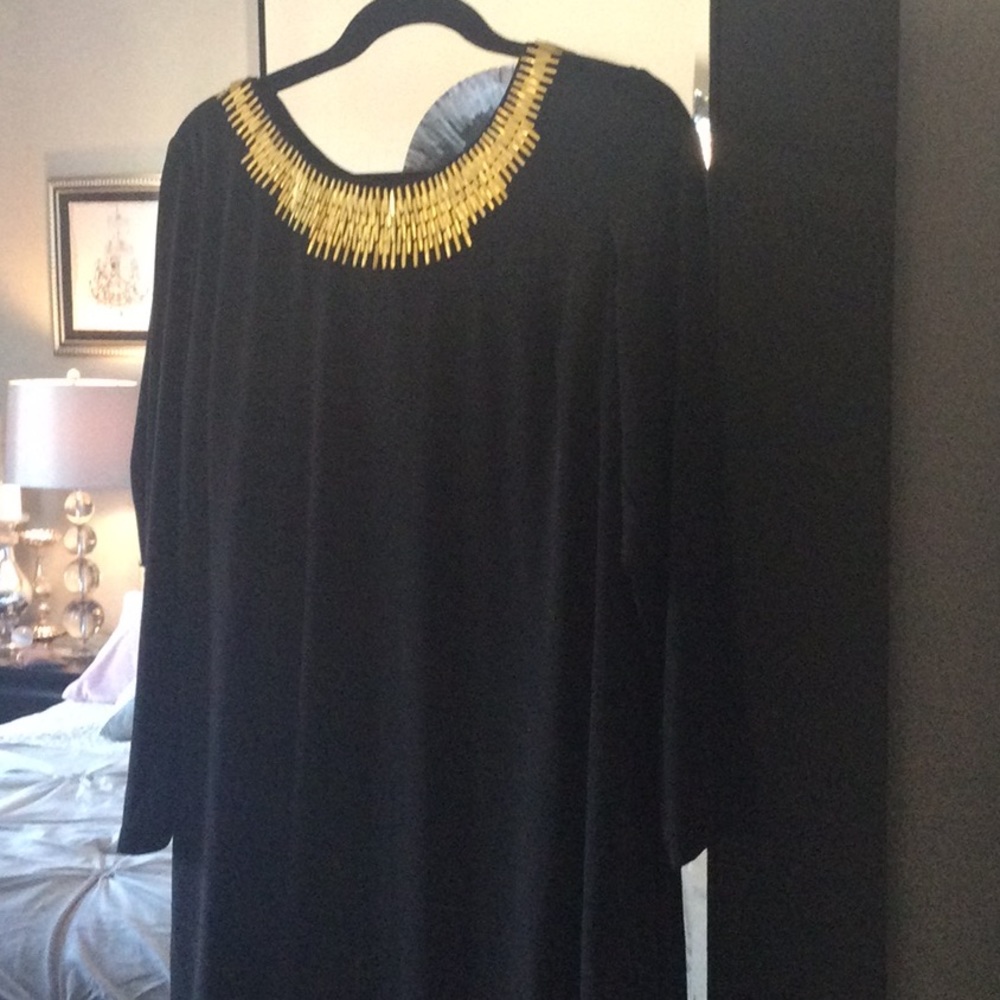 Beautiful Calvin Klein black dress with gold beaded neckline.
